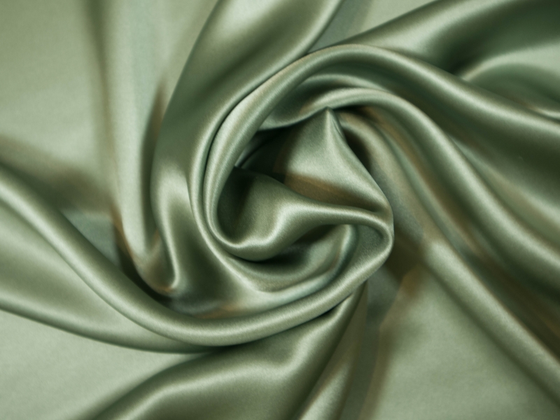 Solid silk charmuese in dill - draped